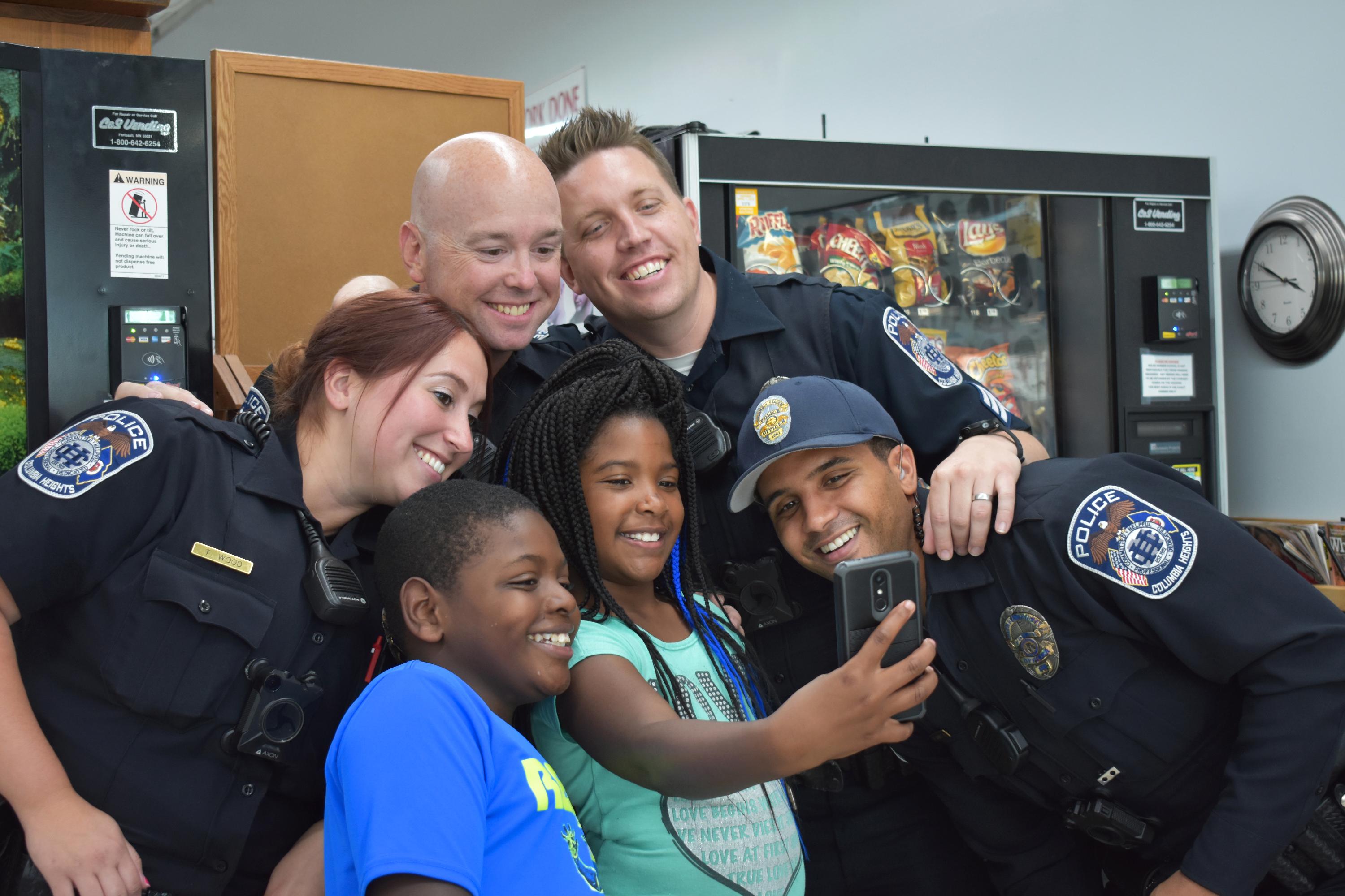 Cuts with a Cop Group Selfie with De'aria Roduez (4th grader) and brother